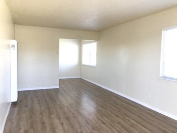Cook Street Apartments spacious room with windows